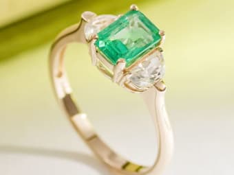 emerald ring set in yellow gold