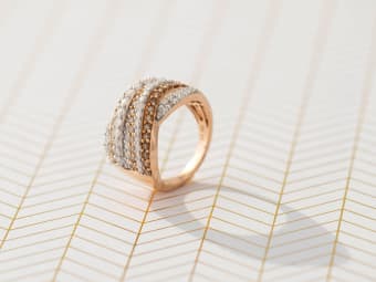 white and brown diamond ring set in rose gold