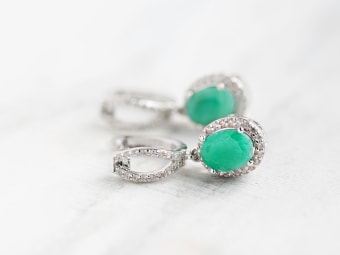 oval shaped emerald earrings set in silver