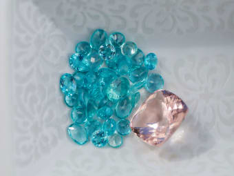 round shaped blue gemstone parcels and emerald shaped morganite