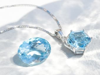 single oval shaped blue topaz gemstone and blue topaz necklace set in silver