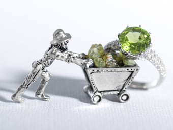 multiple small uncut peridot gemstones and green peridot ring set in silver