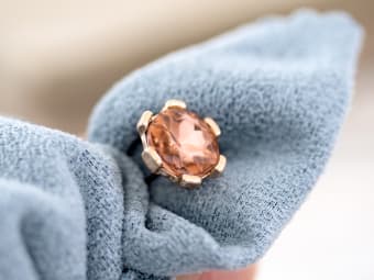 using a synthetic towel to clean gemstone jewelry