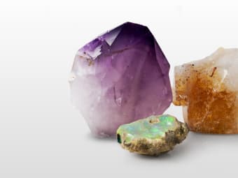 three varieties of uncut gemstone specimens