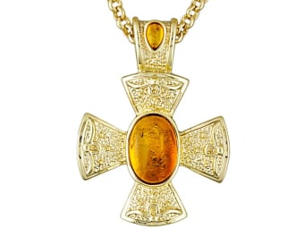 large copal necklace set in a yellow gold cross