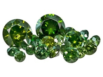 multiple shapes and sizes of green diamond gemstones