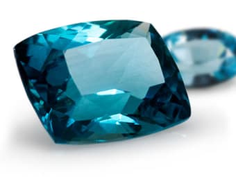large baguette style cut blue zircon gemstone and oval shaped blue
zircon