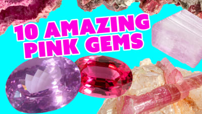 a group of pink crystals and faceted gemstones