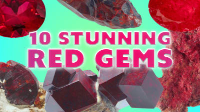 a group of red faceted gemstones and red crystals
