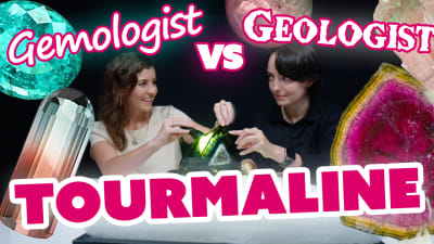 A gemologist and geologist examine tourmaline.