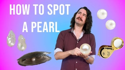 A gemologist observes pearls