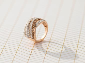 white and brown diamond ring set in rose gold 