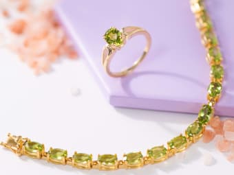 peridot jewelry - peridot tennis bracelet set in yellow gold and peridot ring set in yellow gold 