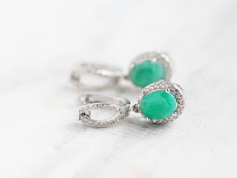 oval shaped emerald earrings set in silver 